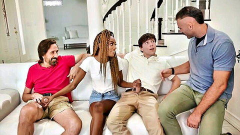 Chanel Skye with two men on couch, casual teasing vibe
