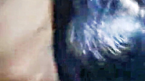 Blurry homemade orgy scene with multiple nude bodies entangled in student room action