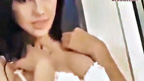 Jennifer Kurosawa in white lace lingerie, teasing cleavage close-up