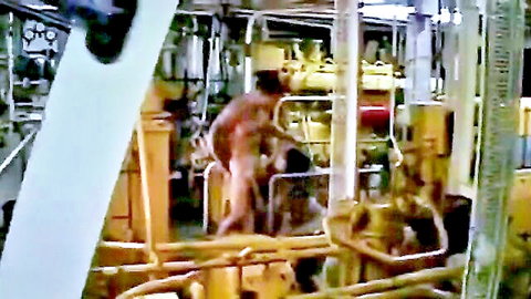 Redhead bent over machinery getting fucked from behind in industrial setting