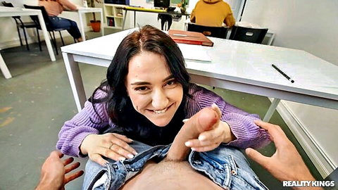 Mandy Muse smiles while gripping hard cock in steamy handjob scene