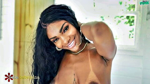 Livia Santana smiling topless pose with long wavy hair