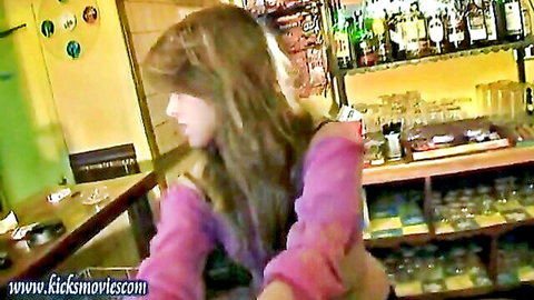 Brunette in pink sweater at bar in hot mixed fight adult scene