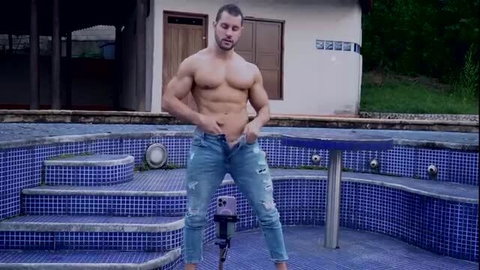 Buff Latino hunk Duncan flexing abs, unbuttoning ripped jeans poolside