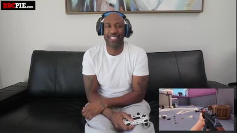 Isabella Jules gaming in white tee and sweats, smiling on stream
