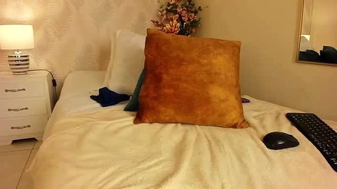Chubby ebony chick's messy bed with pillows and keyboard