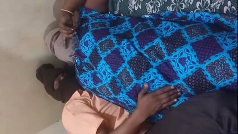 Tamil couple hot foreplay, man groping woman's curves on bed