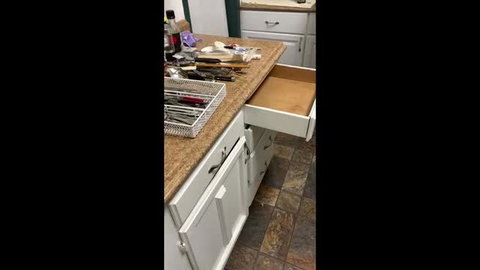 Amateur kitchen drawer swap tease with utensils on counter