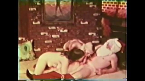 Santa's Darling Helpers: Nude brunette teen orgy with Santa hat threesome