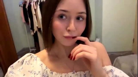 Joanalkins cute cam girl finger on lips, off-shoulder top tease