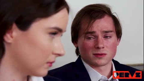 Hazel Moore closeup with young man in suit, tense faceoff