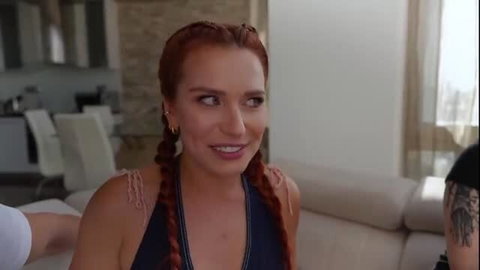 Sata Jones in pigtails smiles seductively with coworkers