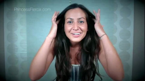 Princess Fierce smiling with hands in long dark hair, teasing CEI