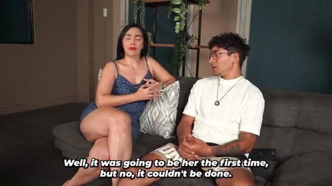Curvy Latina stepmom in dress chats with stepson on couch