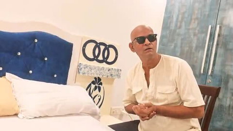 Bald Desi Indian man in shades on bed, stepdad amateur gay thumbnail