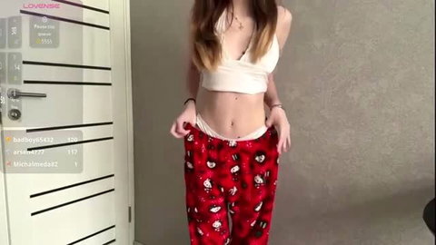 Skinny troybailly in white crop top and Hello Kitty pants, teasing undies down