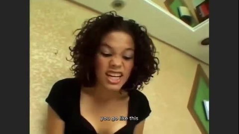 Curly haired black girl screaming 'you go like this' in tight top