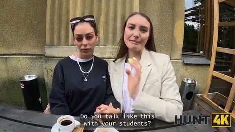 Two hot Euro babes in casual chat, one in hoodie necklace other in blazer