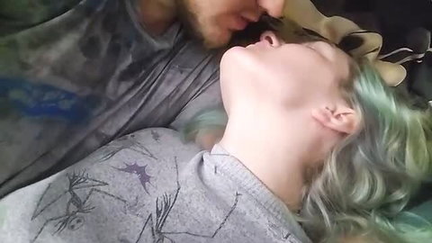 Hot amateur guy kissing teal-haired girl's neck in bed
