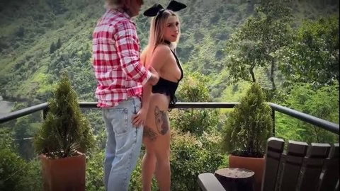 Miss Storm as bunny girl groped by lumberjack on balcony, Snow