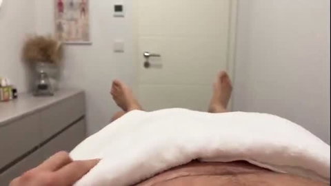 POV intimate massage with towel lifted exposing nude body in clinic