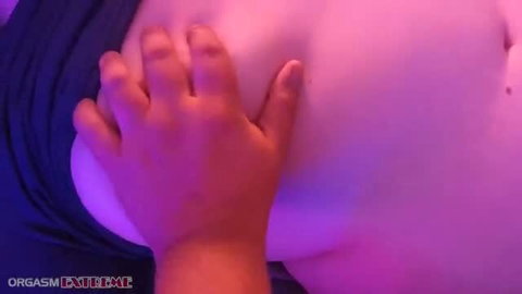 Littleredheadmia's huge natural tits groped by hand in pink light
