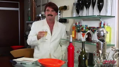 Handsome redhead mustached man in white suit seducing with wine glass