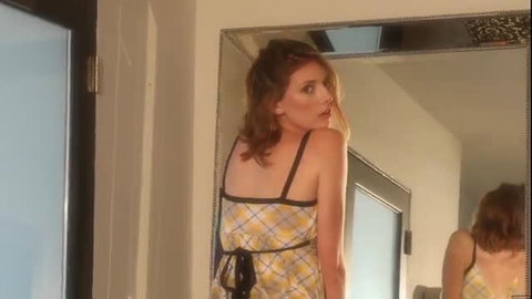 Redhead in yellow checkered dress strips naked in mirror selfie
