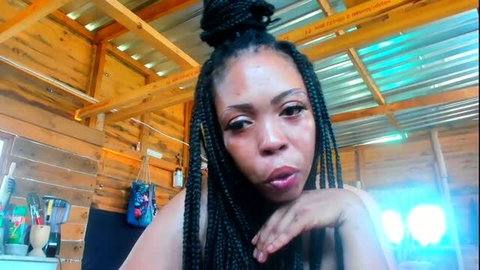 Beautiful black woman with braids tries on sexy fan-bought costume