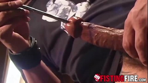 Derrick Hanson cuts condom on Tony Bishop's huge cock in fisting scene