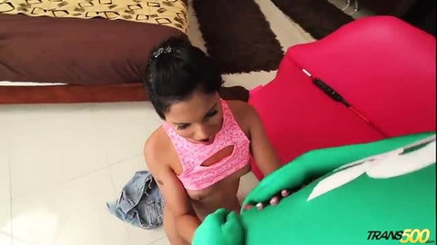 Kylie Maria teases green dildo in pink cutout top behind the scenes