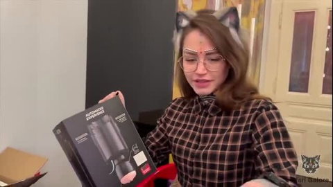 Mari Galore in cat ears unboxes Automated Experience fleshlight machine