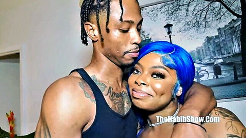 Thick ebony beauty with blue hair hugs her tattooed black man's muscular body intimately