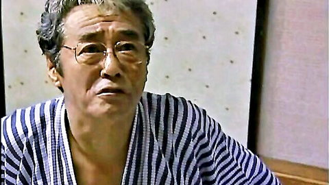 Mature Japanese man in striped robe, intense expression in secret mother-son taboo encounter