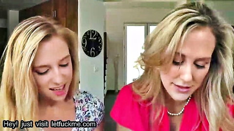 Two blonde babes passionately kissing in kitchen wearing tight tops