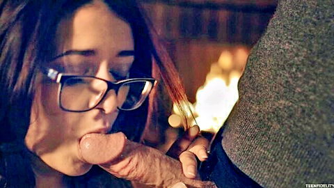 Brunette teen in glasses sucks thick veiny cock by fireplace