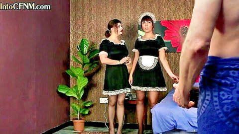 Two British CFNM maids in sexy outfits tease shirtless man in hotel threesome