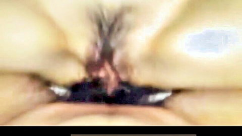 Blurry close-up of wet pussy with pubic hair and visible labia