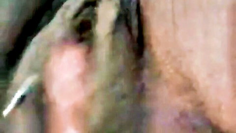 Close-up of woman teasing her huge meaty pussy lips solo