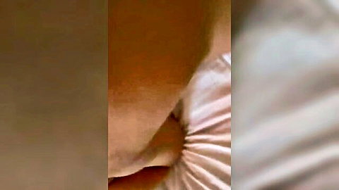 Brown-skinned woman in white top exposing shoulder and chest
