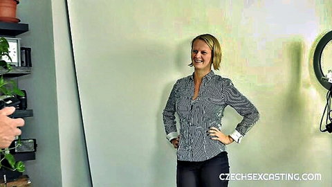 Smiling blonde in striped shirt and black pants at Czech casting