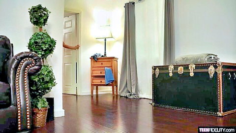 Blake Blossom in girl next door scene, peeking from door in cozy room