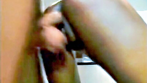 Blurry amateur closeup of dark-skinned body during sex act