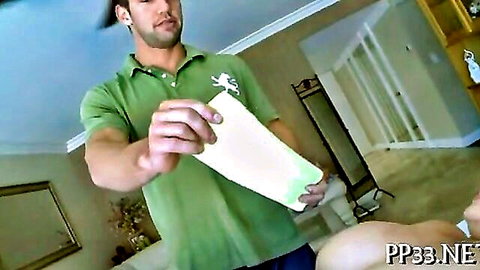 Muscular guy in green polo holds white towel near naked pale ass in steamy bathroom