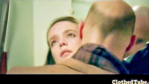 Stacy Martin in intense clothed embrace with man in Nymphomaniac scene