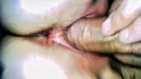 Thick cock penetrates stretched pink asshole of curvy white MILF as hand spreads perfect ass cheeks