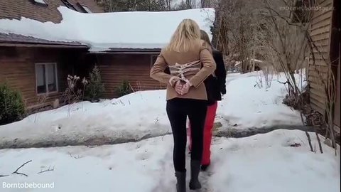 Ophelia K bound outdoors in snow, worships red leather boots