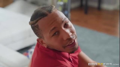 Ricky Johnson in red shirt on bed, Brazzers MILF preview