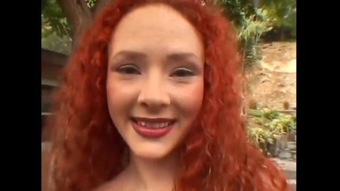 Breasty redhead Audrey Hollander smiling closeup