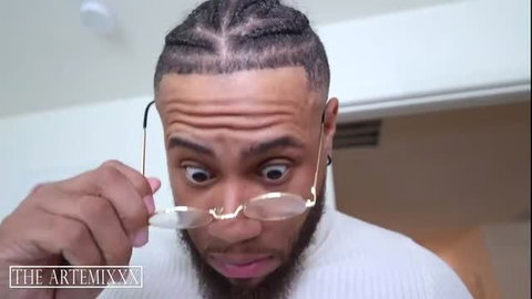 Kimmie Liu closeup shocked face with braids beard gold glasses